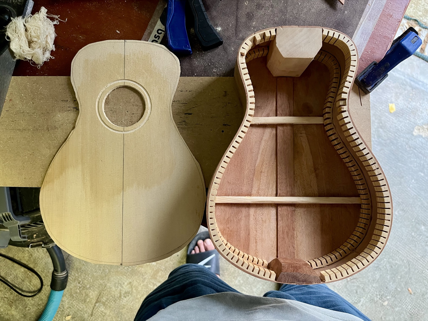 Acoustic guitar body halves showing interior kerfing and bracing